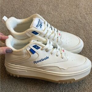 Reebok sneakers with blue accents, never worn.